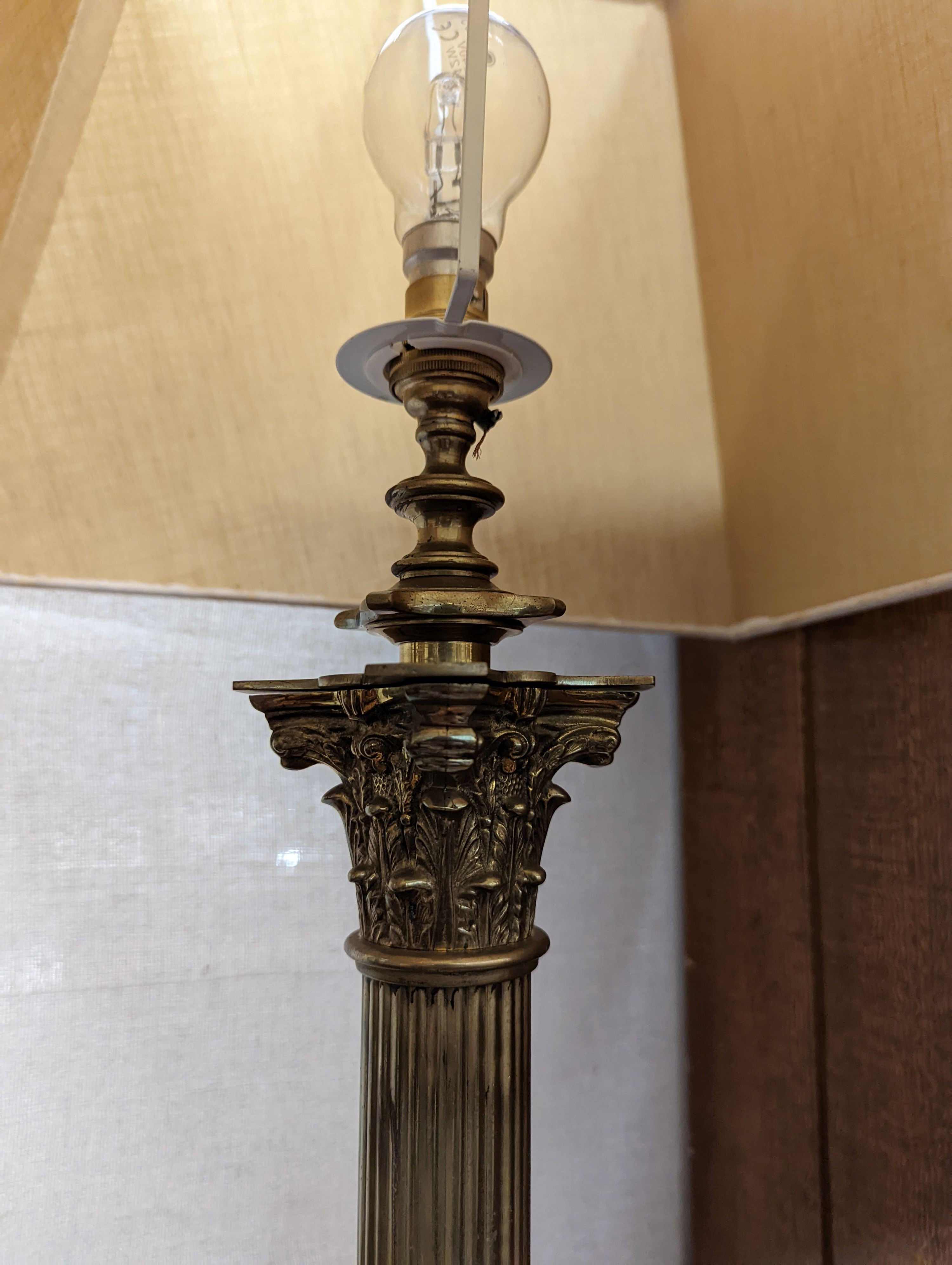 An early 20th century brass Corinthian column standard lamp